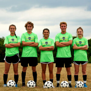 high school soccer players posing for camera